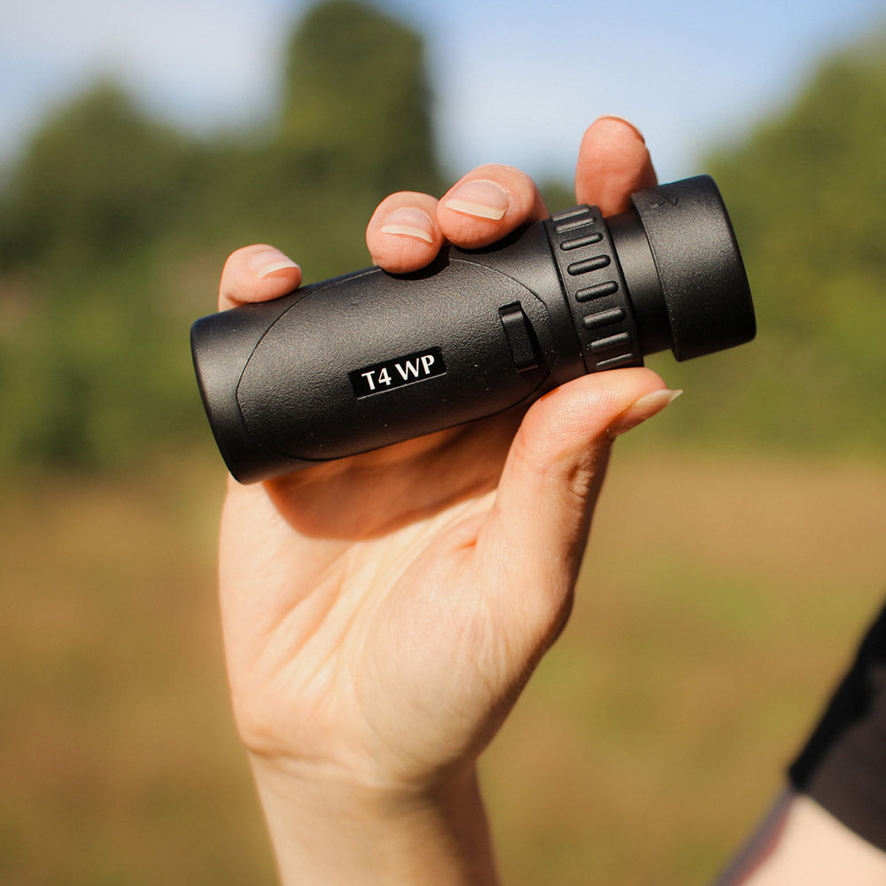 Person holding Opticron T4 WP 8x25 monocular