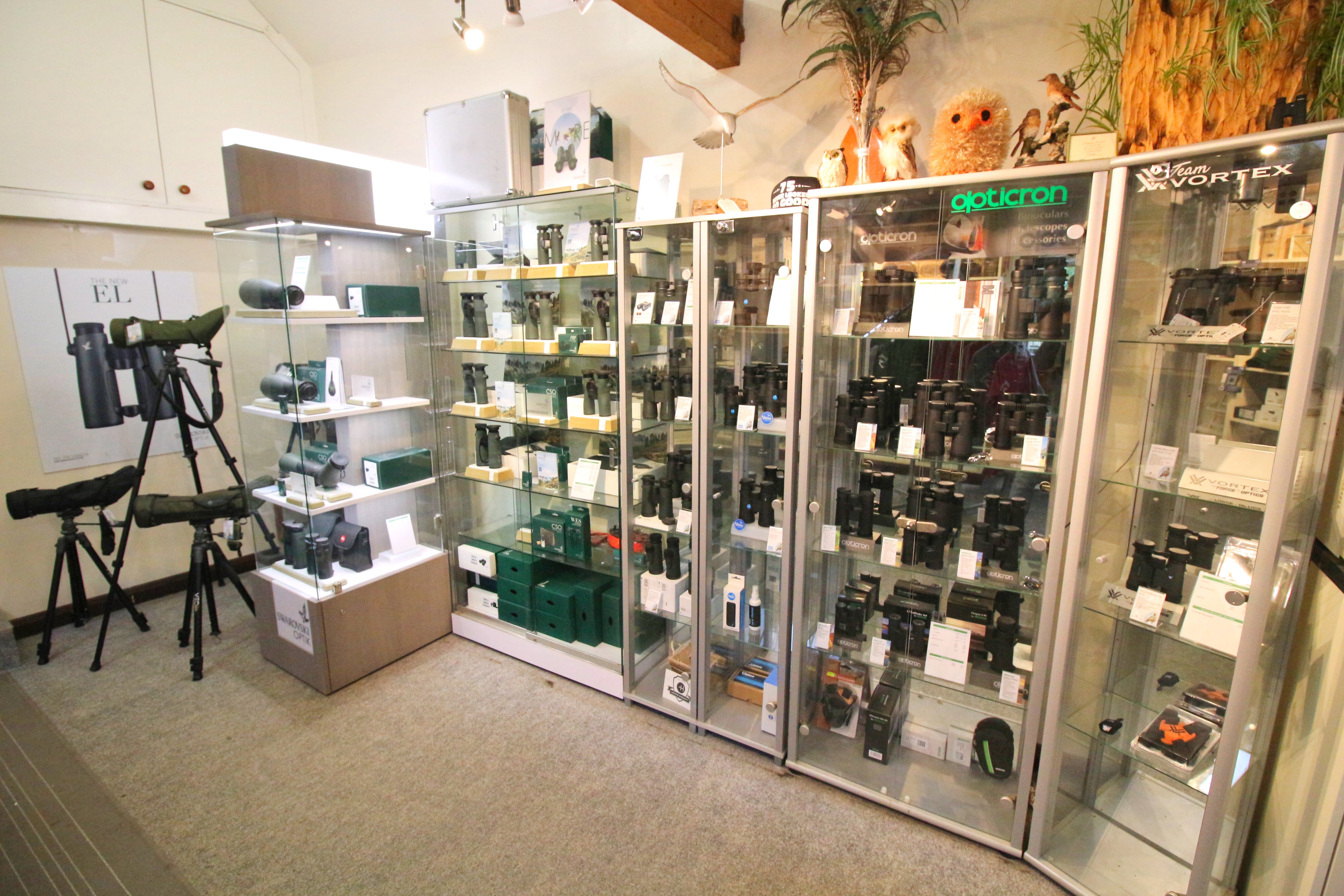 Binocular display cabinets and spotting scopes